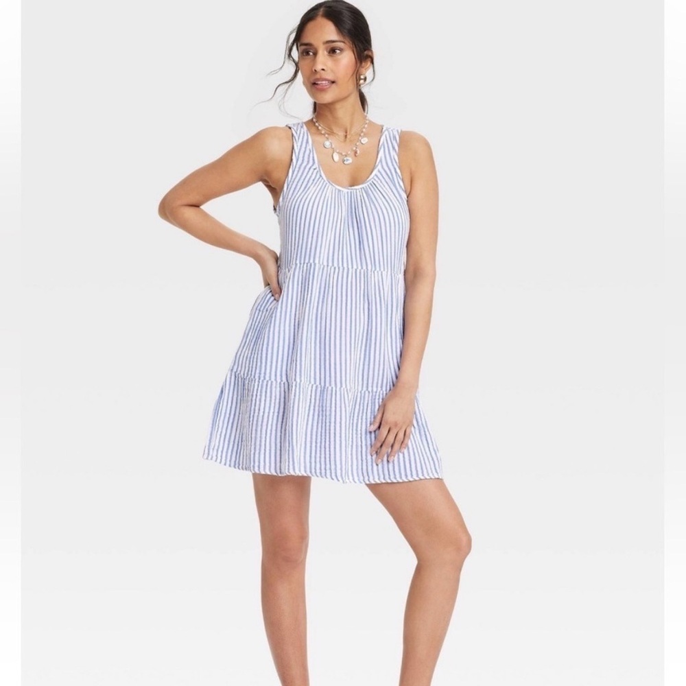 Blue and white striped sleeveless tiered mini sundress with pockets